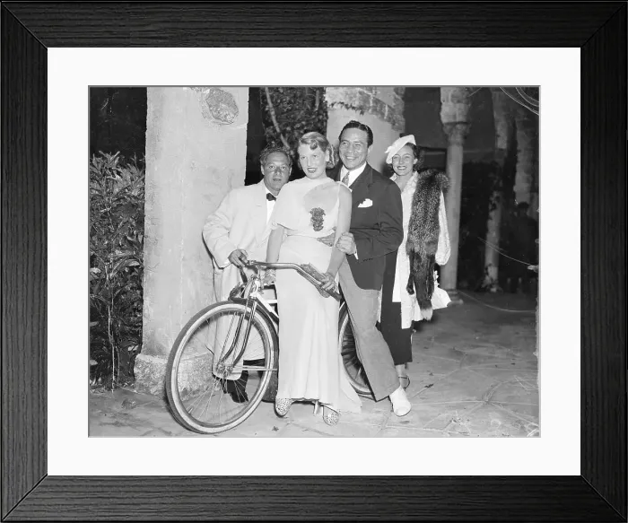 Framed Print : Comedian George Jessel with Boxer Max Baer on Bicycle