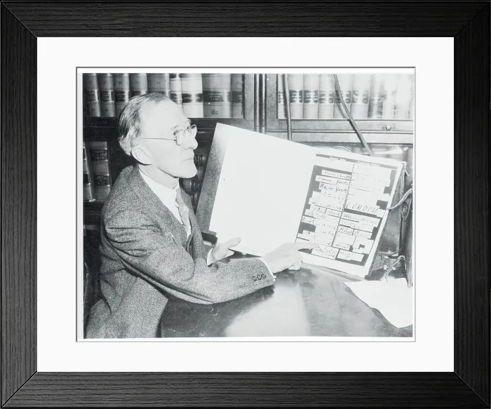 Framed Print : J.M. Trendley Examining Evidence