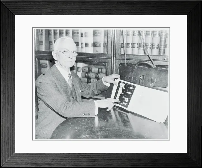 Framed Print : John F. Tyrrell Examining Evidence