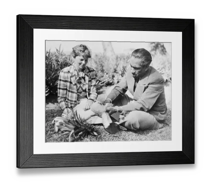 Framed Print : Duke Kahanamoku Eating Pineapple with Amelia Earhart Framed Print : Duke Kahanamoku Eating Pineapple with Amelia Earhart