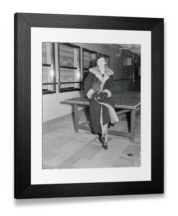 Framed Print : Female Socialite Sitting and Posing on Table Framed Print : Female Socialite Sitting and Posing on Table