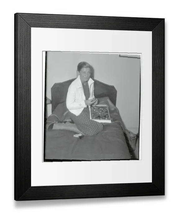 Framed Print : Elly Beinhorn Sitting on a Bed Framed Print : Elly Beinhorn Sitting on a Bed