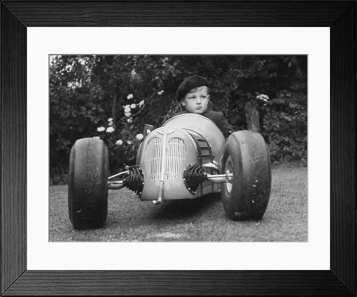 Framed Print : Boy Sitting in His Grand Prix Model Racing Car Framed Print : Boy Sitting in His Grand Prix Model Racing Car