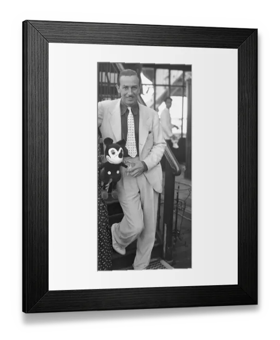 Framed Print : Walt Disney Standing with Mickey Mouse Doll Framed Print : Walt Disney Standing with Mickey Mouse Doll