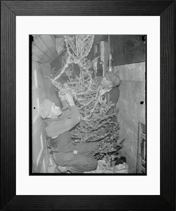 Framed Print : Men Decorating a Christmas Tree Framed Print : Men Decorating a Christmas Tree