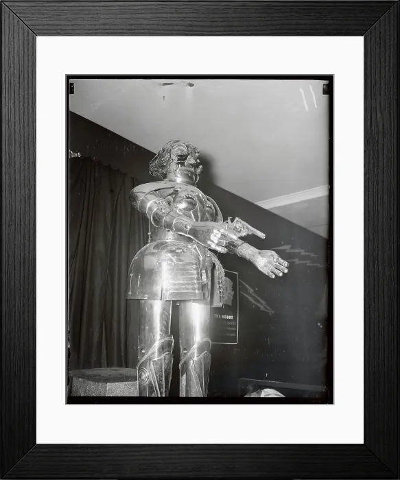 Framed Print : Robot Holding Gun Framed Print : Robot Holding Gun