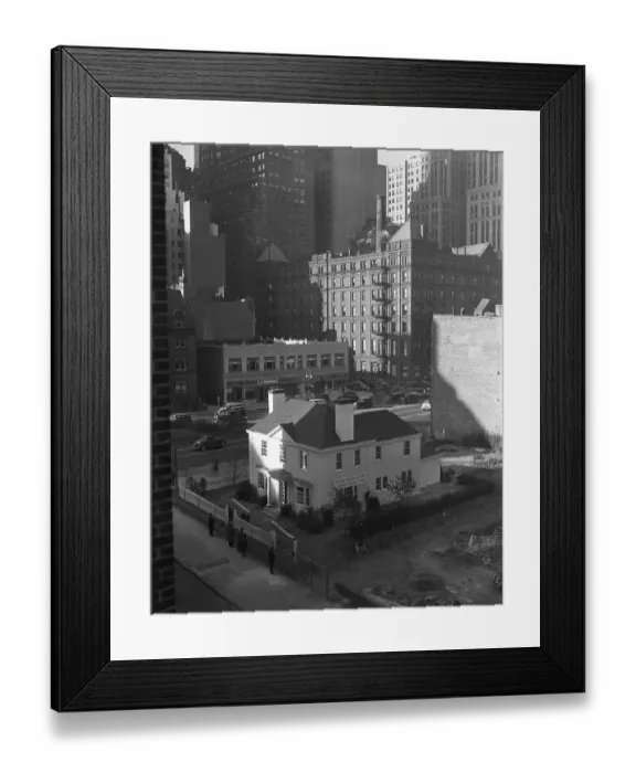 Framed Print : A Little Suburban Cottage Rises Among the Skyscrapers Framed Print : A Little Suburban Cottage Rises Among the Skyscrapers