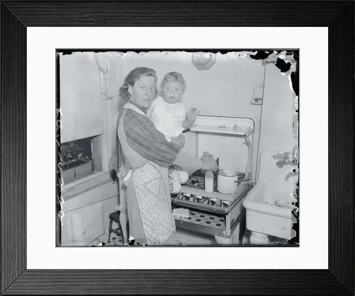 Framed Print : Anna Hauptmann Holding Baby at Stove Framed Print : Anna Hauptmann Holding Baby at Stove