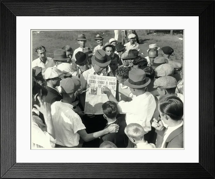 Framed Print : Textile Workers Look at Newspaper Framed Print : Textile Workers Look at Newspaper