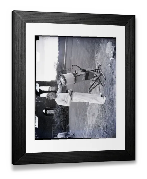 Framed Print : Edward Serrano Loads Balls Into Machine