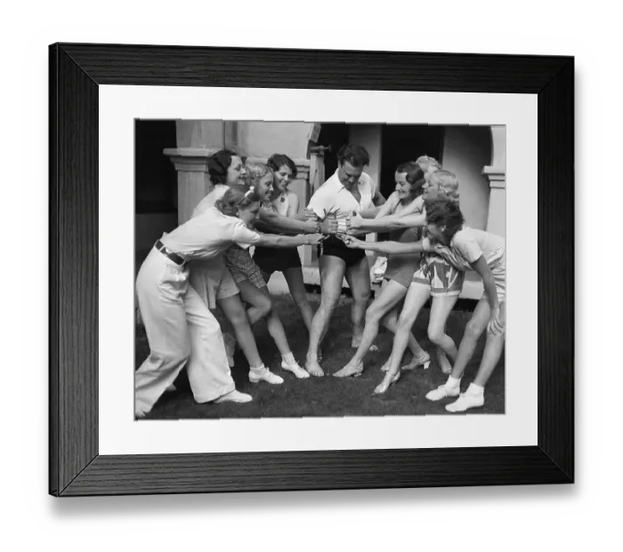 Framed Print : Seven Models Pulling One Man Framed Print : Seven Models Pulling One Man