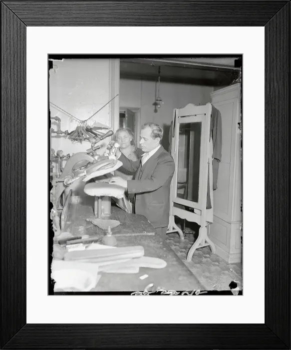 Framed Print : Tailor and Wife Pressing Clothes in Their Shop Framed Print : Tailor and Wife Pressing Clothes in Their Shop
