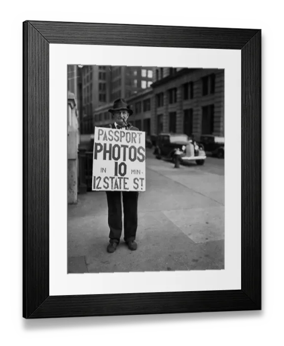 Framed Print : Man In Sandwich Sign For Passport Photos Framed Print : Man In Sandwich Sign For Passport Photos