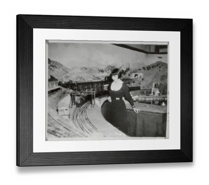 Framed Print : Woman Standing by Large Toy Train Set Framed Print : Woman Standing by Large Toy Train Set