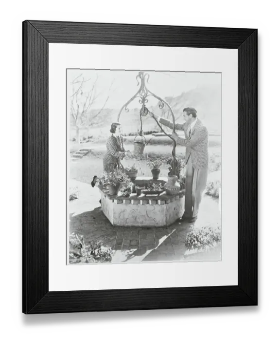 Framed Print : Gary Cooper and Wife at Wishing Well Framed Print : Gary Cooper and Wife at Wishing Well