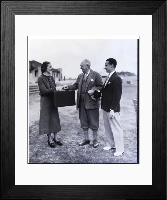 Framed Print : Woman Receives Briefcase with Prize Framed Print : Woman Receives Briefcase with Prize