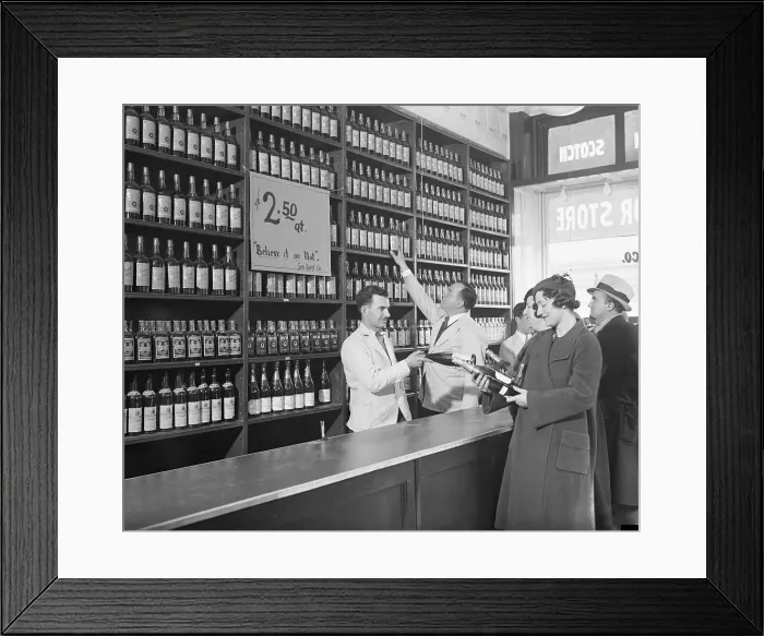 Framed Print : Liquor Store Clerks Helping Customers Make Purchases Framed Print : Liquor Store Clerks Helping Customers Make Purchases
