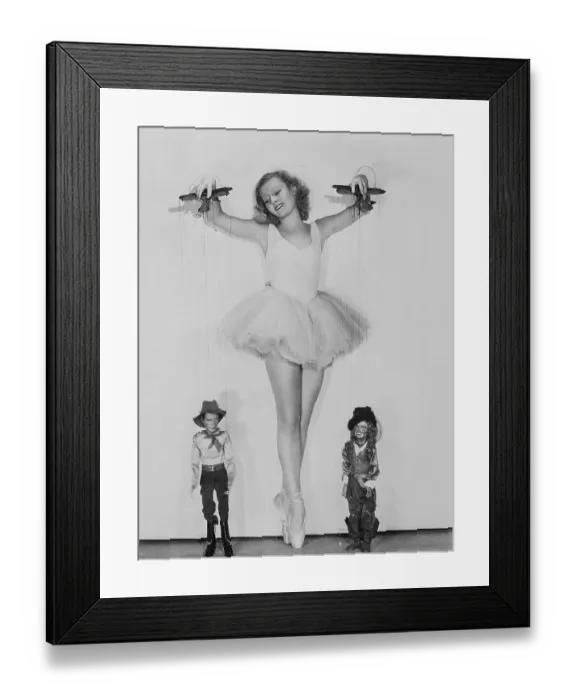 Framed Print : Actress Lilian Harvey Holding Puppets Framed Print : Actress Lilian Harvey Holding Puppets