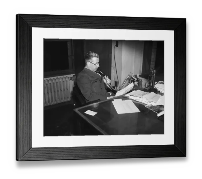 Framed Print : Man at Desk Dictates into Dictaphone
