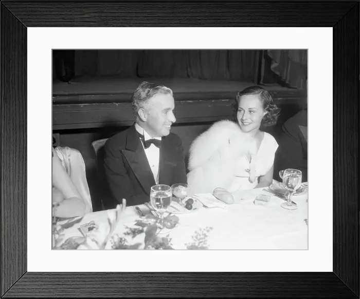 Framed Print : Charlie Chaplin and Paulette Goddard at Banquet Framed Print : Charlie Chaplin and Paulette Goddard at Banquet