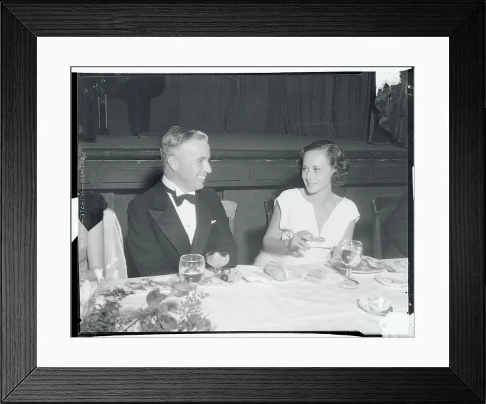 Framed Print : Charlie Chaplin Chatting with Paulette Goddard Framed Print : Charlie Chaplin Chatting with Paulette Goddard
