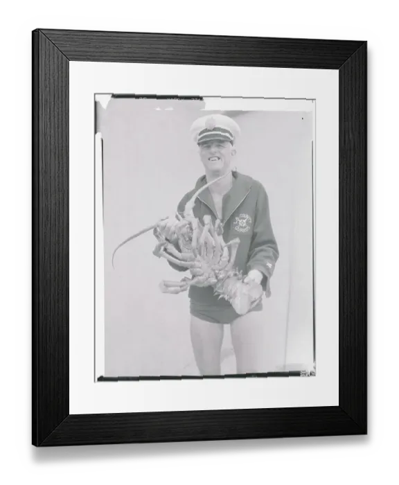 Framed Print : Lifeguard Displaying Large Lobster