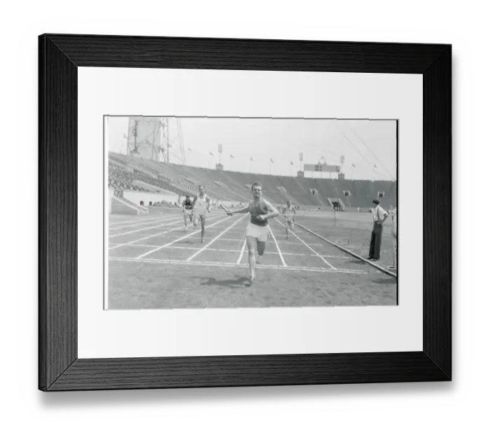 Framed Print : Runner Crossing Finish Line