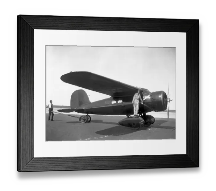 Framed Print : Amelia Earhardt Posing with Airplane Framed Print : Amelia Earhardt Posing with Airplane