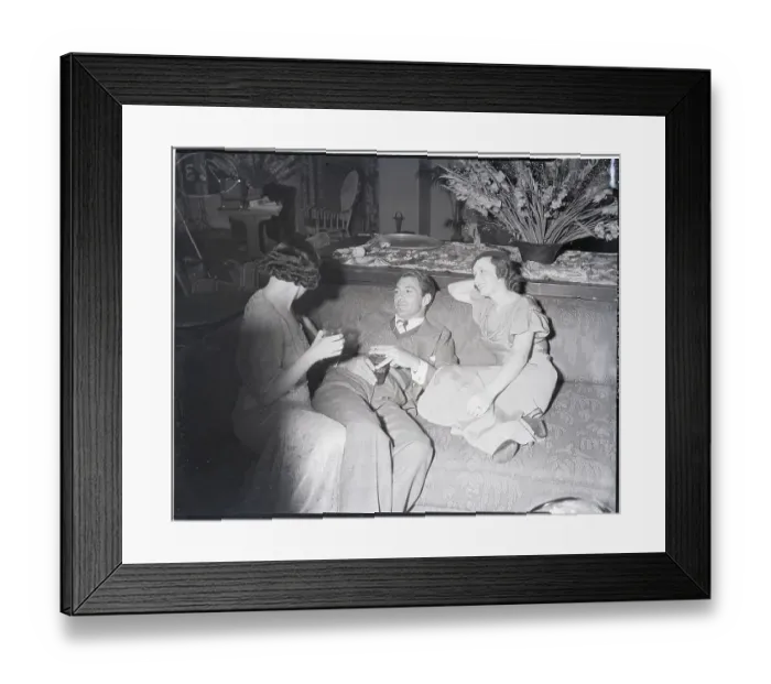 Framed Print : Gary Cooper Relaxes with two Women at Party Framed Print : Gary Cooper Relaxes with two Women at Party