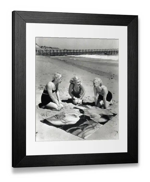 Framed Print : Three Blonde Women on Beach with Puzzle Framed Print : Three Blonde Women on Beach with Puzzle