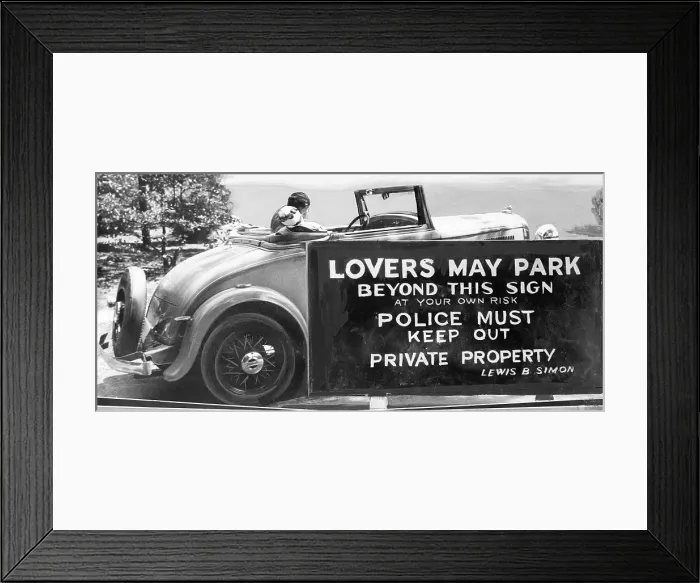 Framed Print : Couple Kissing in Car near Regulatory Sign Framed Print : Couple Kissing in Car near Regulatory Sign