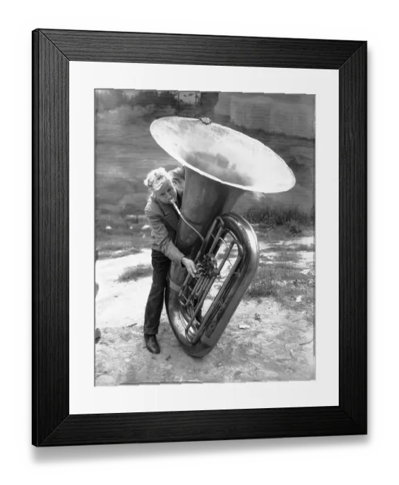Framed Print : Harry S. Hobson Attempting to Blow Large Bass Horn Framed Print : Harry S. Hobson Attempting to Blow Large Bass Horn