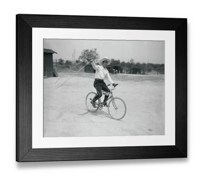 Framed Print : Tom Mix Riding Bicycle Framed Print : Tom Mix Riding Bicycle