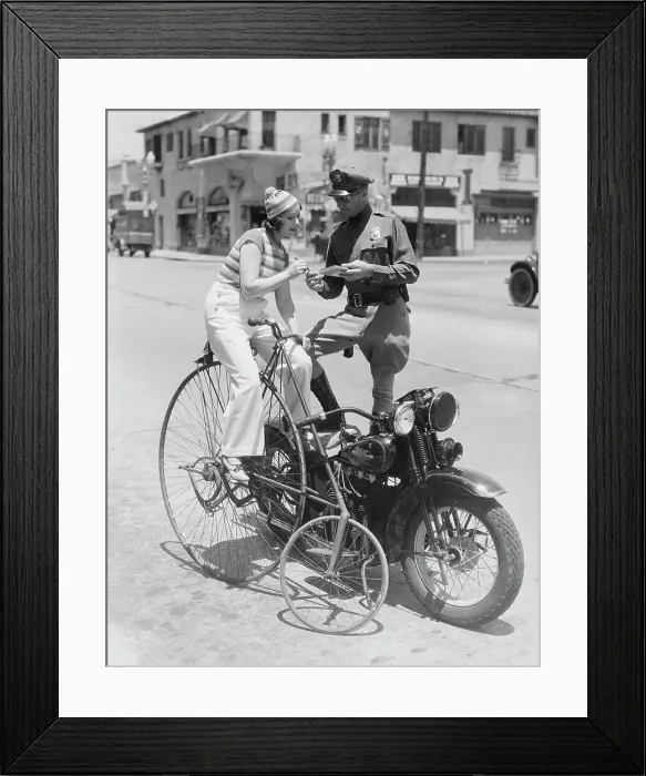 Framed Print : Bicyclist Receiving Ticket from Motorcycle Police Officer Framed Print : Bicyclist Receiving Ticket from Motorcycle Police Officer