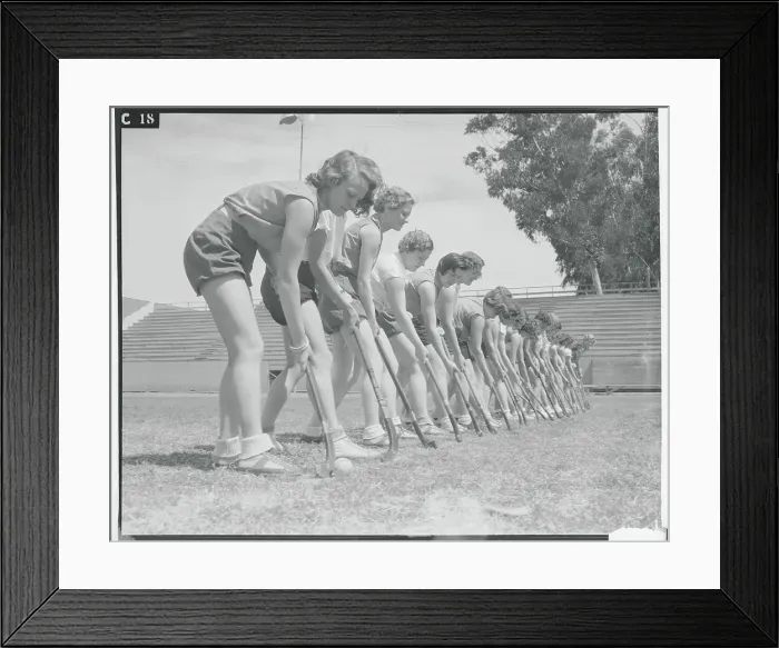 Framed Print : Female Hockey Teammates Practicing Position on Field Framed Print : Female Hockey Teammates Practicing Position on Field