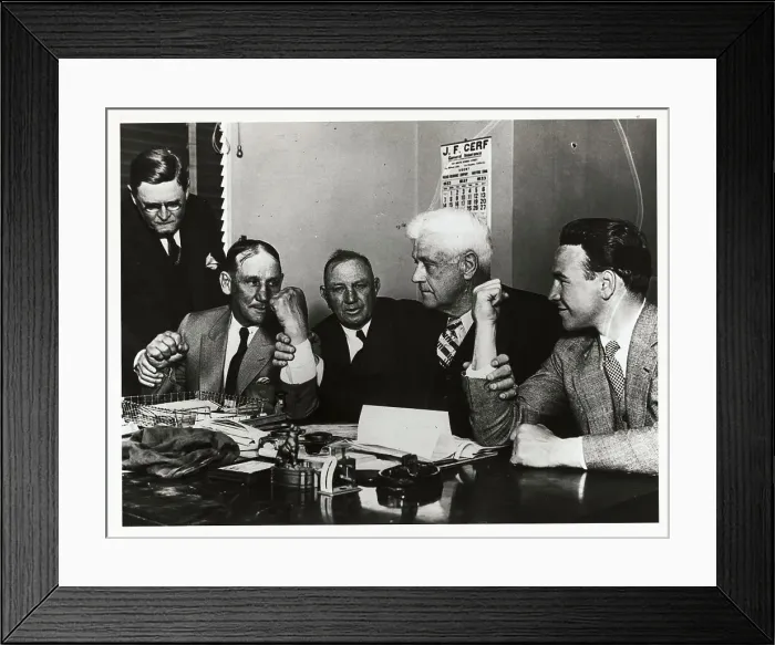 Framed Print : Comparing Fists Around A Table Framed Print : Comparing Fists Around A Table