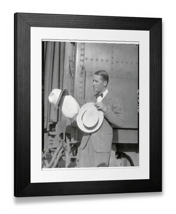 Framed Print : Maurice Chevalier Posing with Hats by Train Car