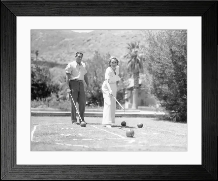 Framed Print : Actress Billie Dove and Husband Robert Kenaston Playing Game Framed Print : Actress Billie Dove and Husband Robert Kenaston Playing Game
