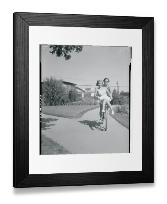 Framed Print : Eleanor Holm and Dorothy Lee Riding Bicycle Framed Print : Eleanor Holm and Dorothy Lee Riding Bicycle