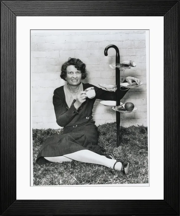 Framed Print : Woman Reclining in Picnic Fashion with New Utensil Framed Print : Woman Reclining in Picnic Fashion with New Utensil