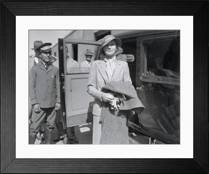 Framed Print : Actress Greta Garbo Pausing Outside Taxi