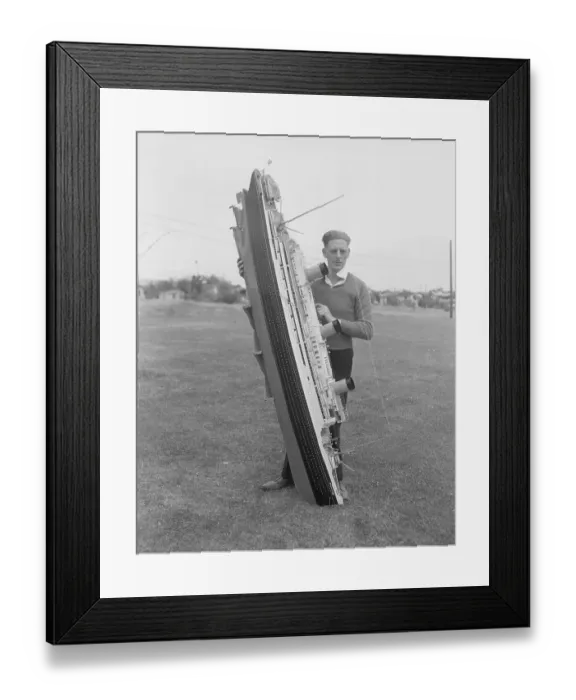 Framed Print : Man Holding Ship Model Framed Print : Man Holding Ship Model