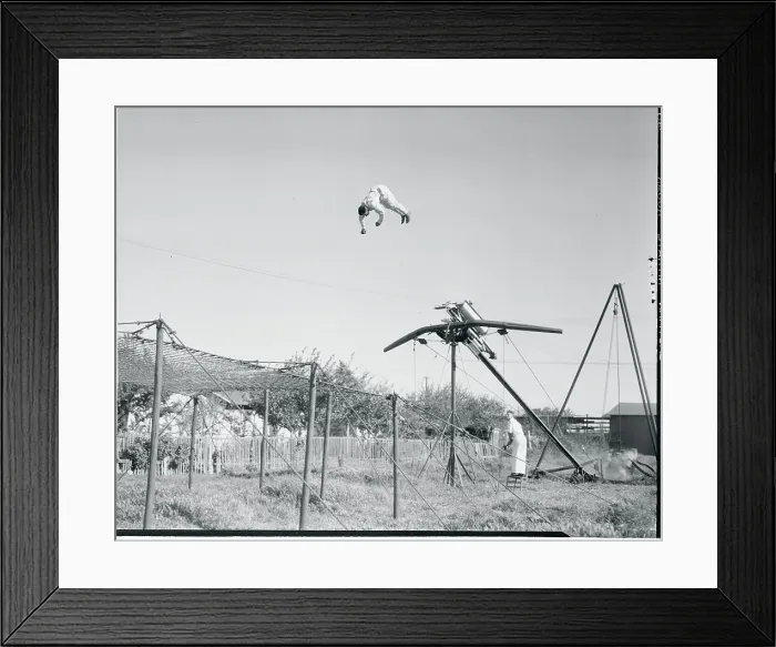 Framed Print : Man Being Catapulted Through the Air Framed Print : Man Being Catapulted Through the Air
