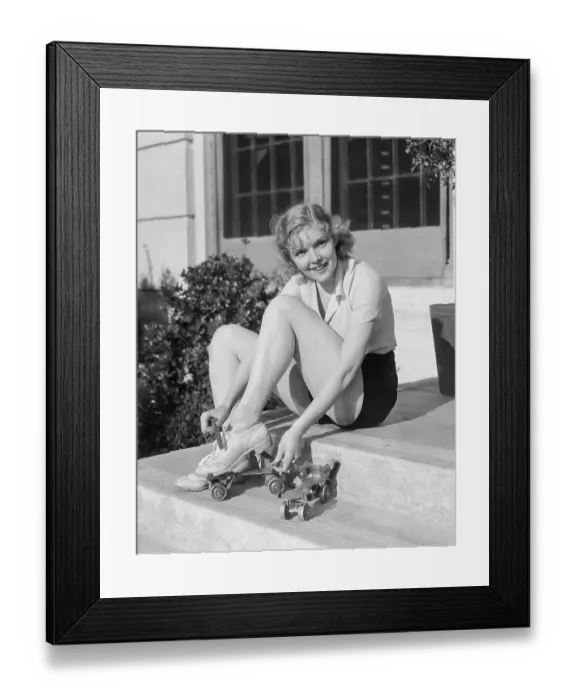 Framed Print : Young Woman Putting on Roller Skates Framed Print : Young Woman Putting on Roller Skates