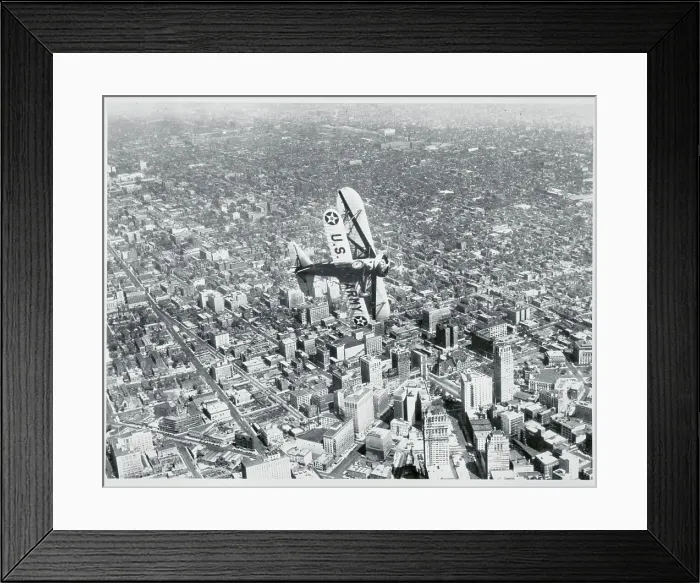 Framed Print : Army Airplane Flying Above City Framed Print : Army Airplane Flying Above City