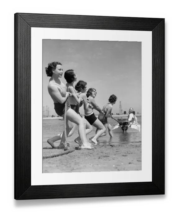 Framed Print : Vintage photograph showing young women playing tug of war with motorboat Framed Print : Vintage photograph showing young women playing tug of war with motorboat