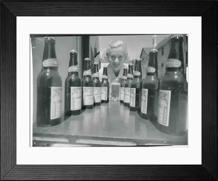 Framed Print : Shirley Grey Posing with Beer Bottles Framed Print : Shirley Grey Posing with Beer Bottles