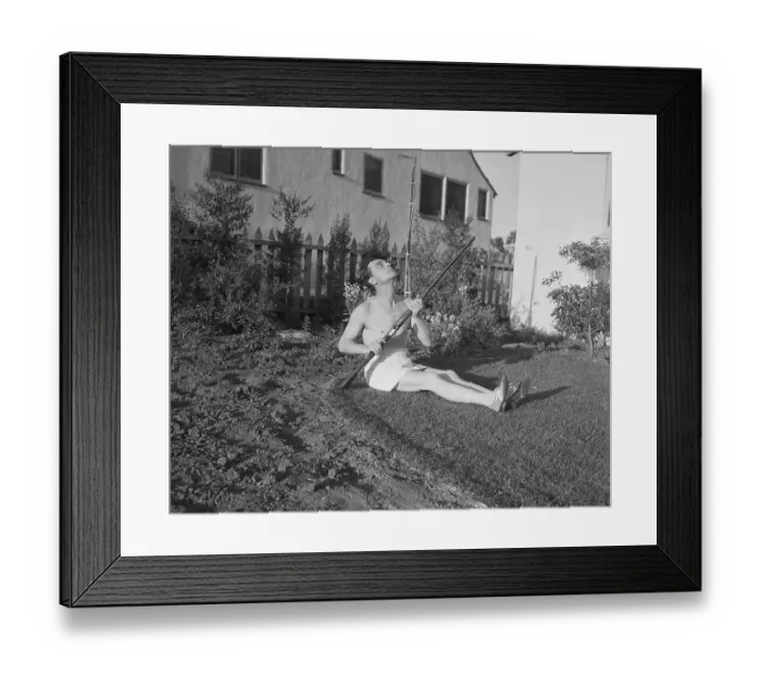 Framed Print : Buster Keaton Sunbathing with Shotgun