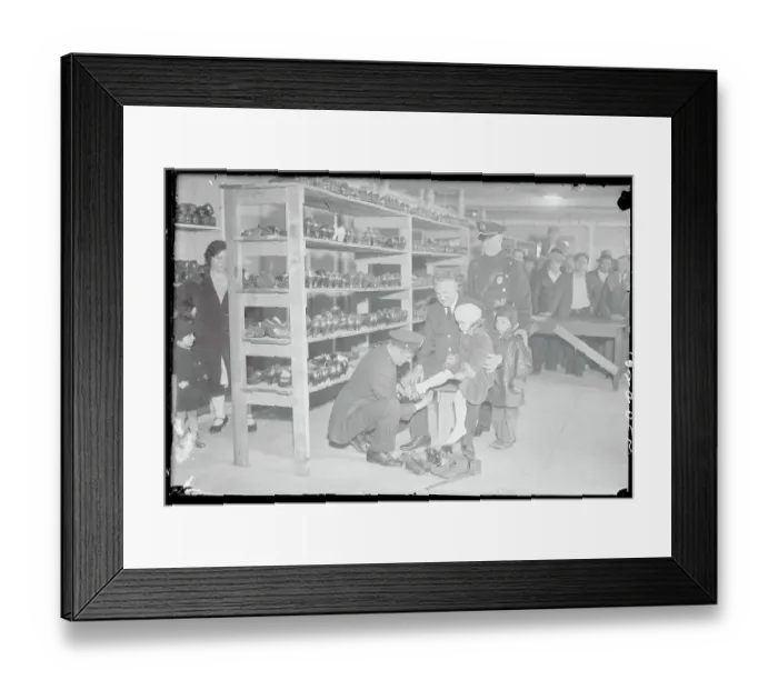 Framed Print : Policeman Fitting Child's Shoe Framed Print : Policeman Fitting Child's Shoe
