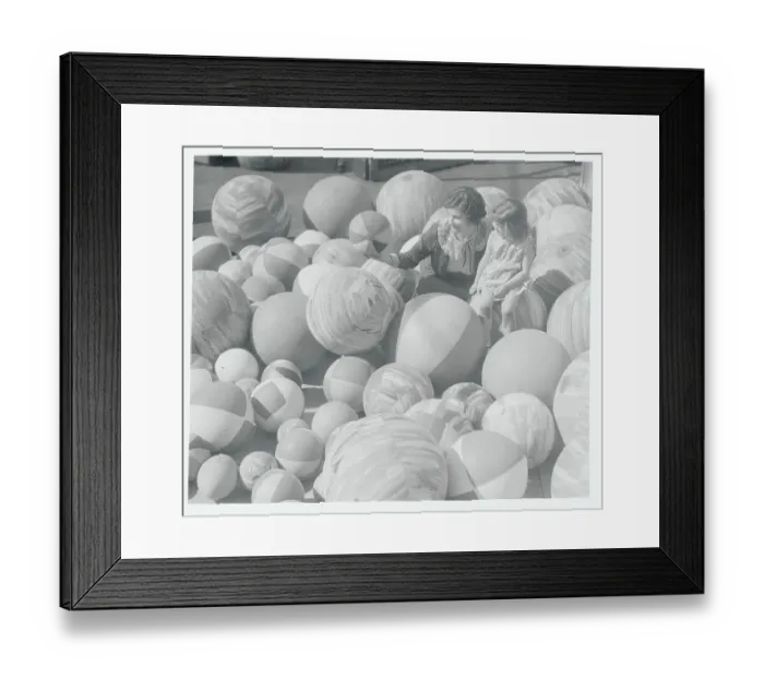 Framed Print : Woman and Child Observing Beach Balls Framed Print : Woman and Child Observing Beach Balls